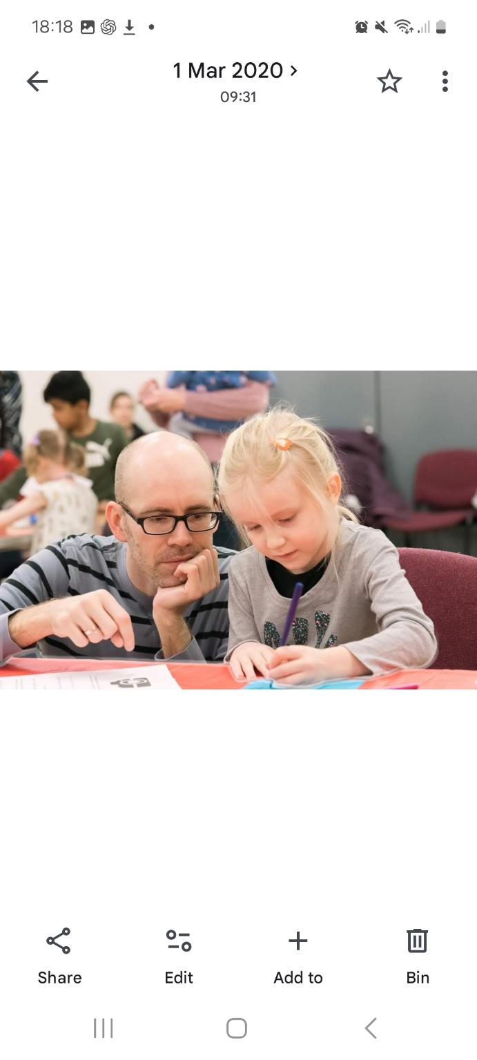 A father and daughter working on an investigation together at a STEM Goes Wild workshop