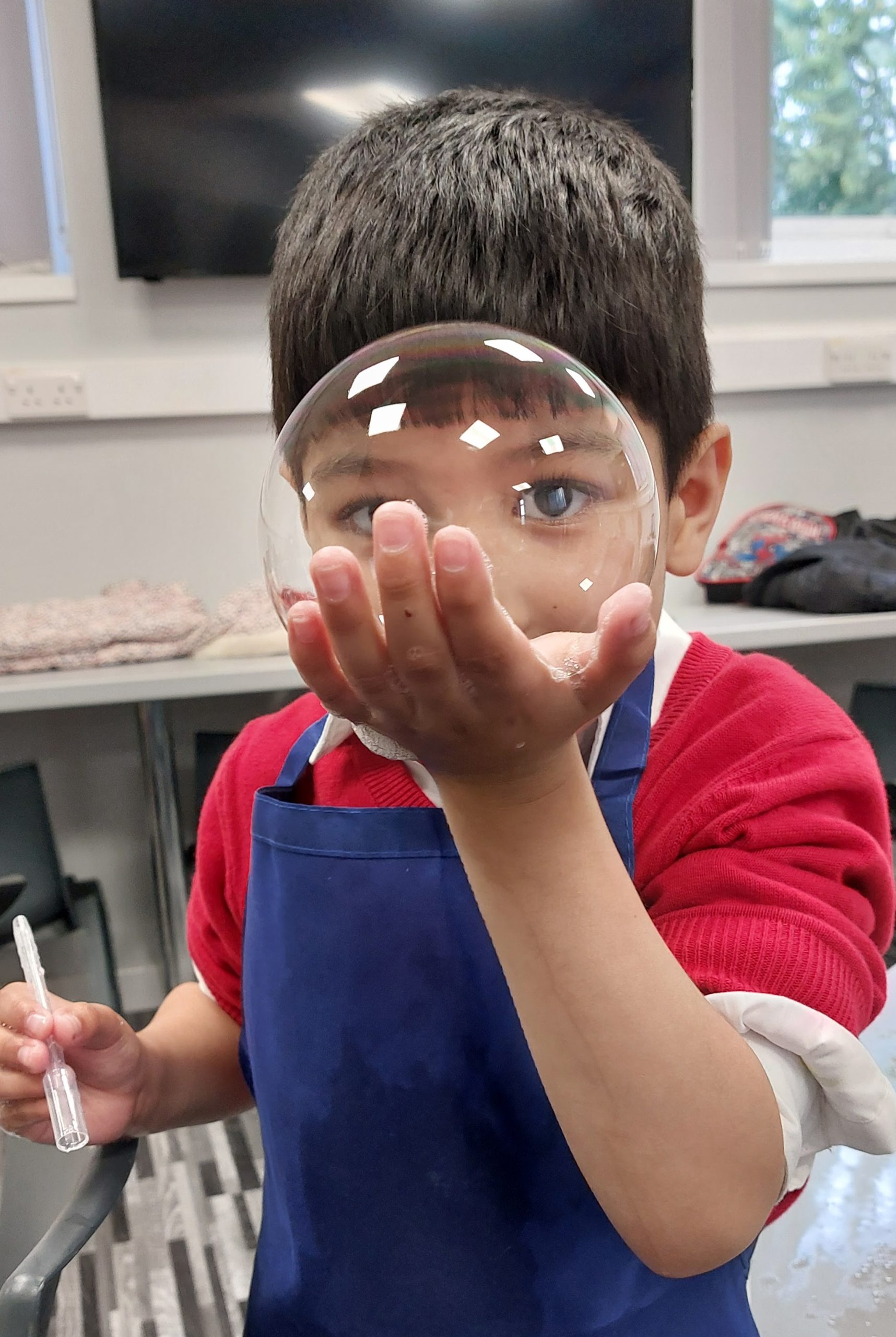 Children making light-up paper circuit projects