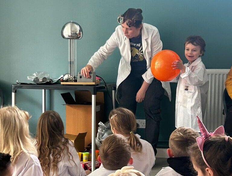 Children building light-up paper circuit projects